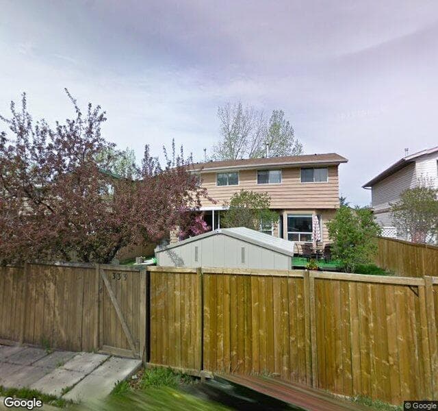 Street view of 333 Woodvale Crescent SW, Calgary
