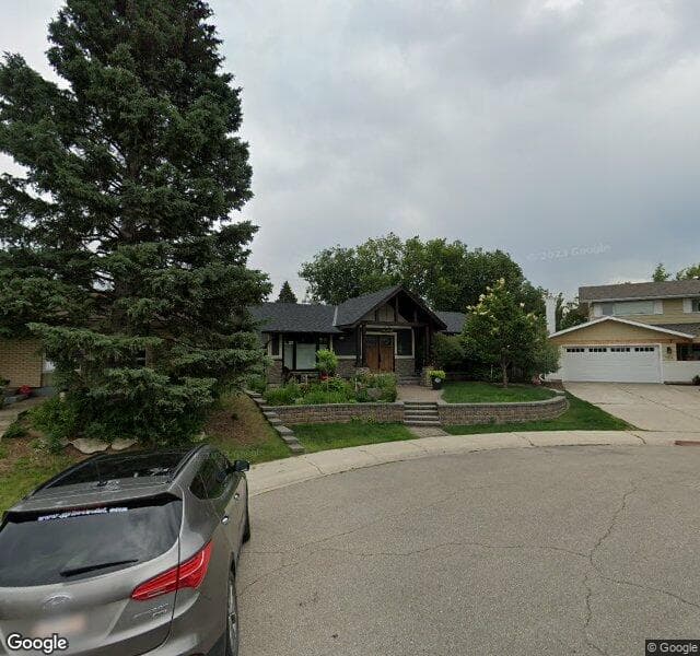 Street view of 160 Lake Acadia Place SE, Calgary