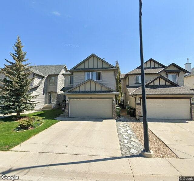 Street view of 215 Cougarstone Court SW, Calgary