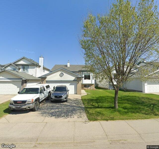 Street view of 827 Harvest Hills Drive NE, Calgary