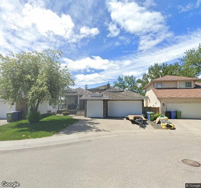 Street view of 128 Douglas Shore Close SE, Calgary