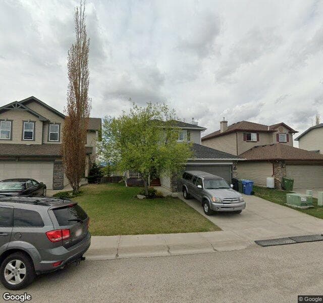 Street view of 90 Rockbluff Close NW, Calgary
