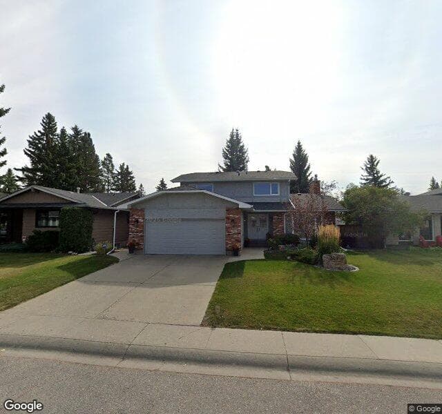 Street view of 211 Lake Lucerne Way SE, Calgary
