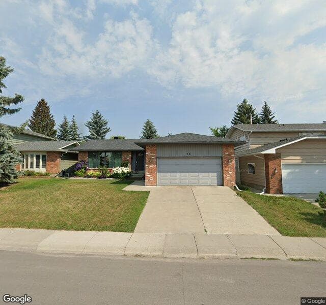Street view of 28 Woodmont Drive SW, Calgary
