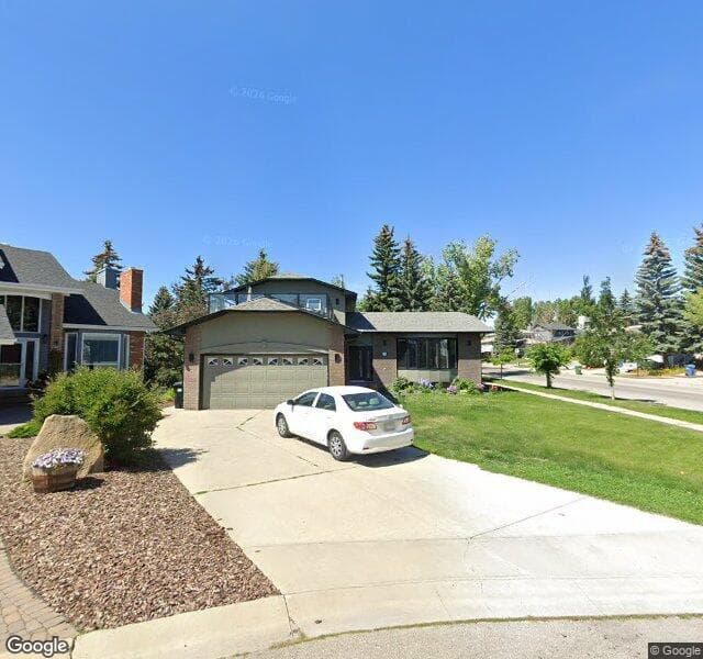 Street view of 303 Stravanan Bay SW, Calgary