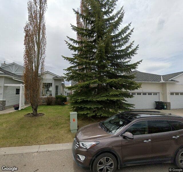 Street view of 108 Rocky Ridge Villas NW, Calgary