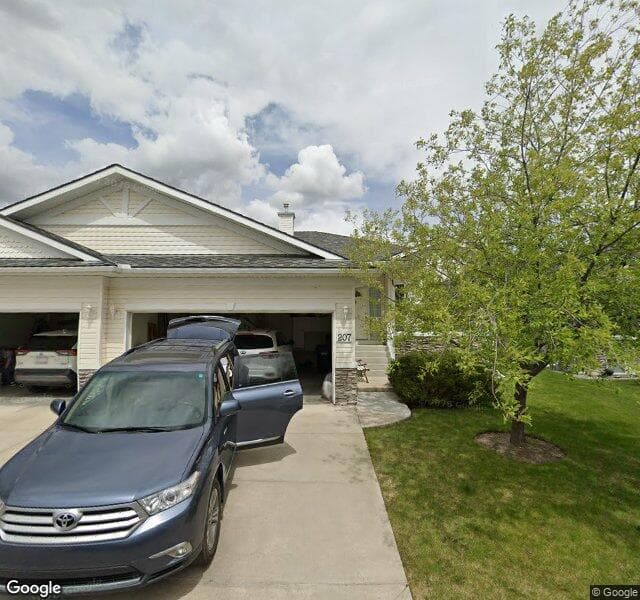 Street view of 207 Rocky Ridge Villas NW, Calgary