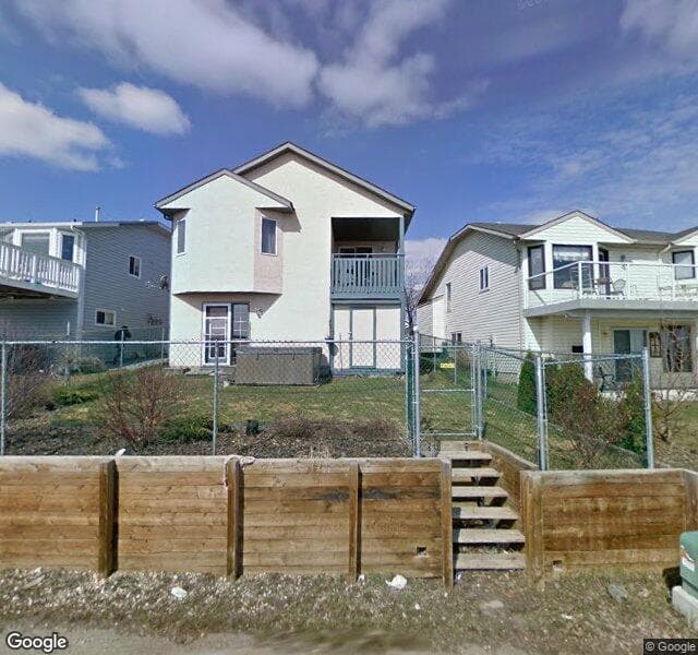 Street view of 952 Harvest Hills Drive NE, Calgary