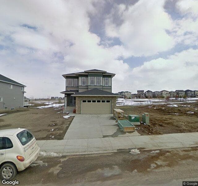 Street view of 1084 Panamount Boulevard NW, Calgary