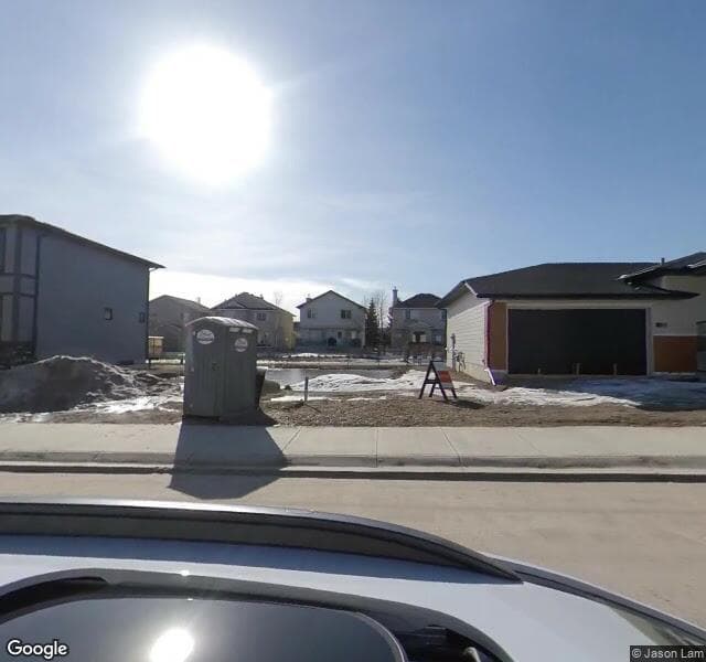 Street view of 77 Harvest Hills Manor NE, Calgary