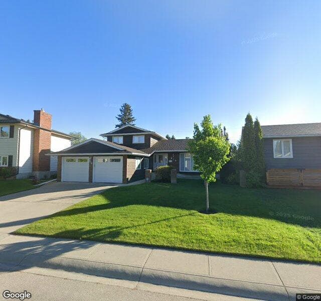 Street view of 816 Lake Lucerne Drive SE, Calgary