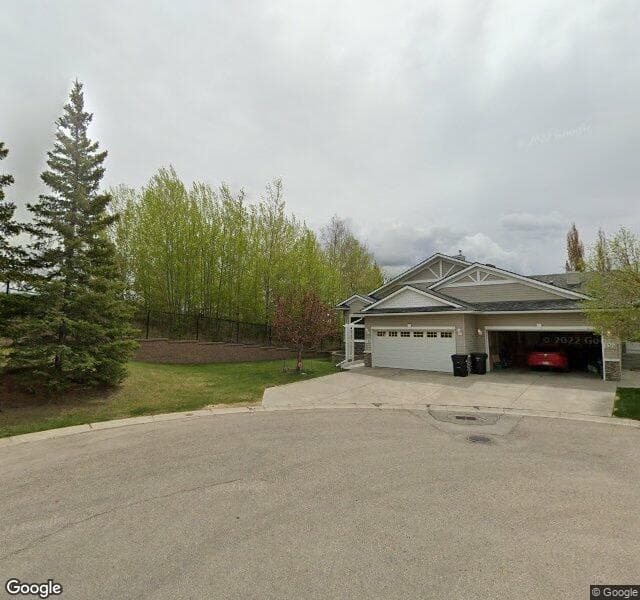 Street view of 132 Rocky Ridge Villas NW, Calgary