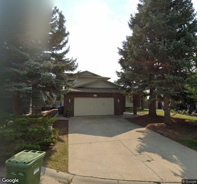 Street view of 44 Woodgrove Crescent SW, Calgary
