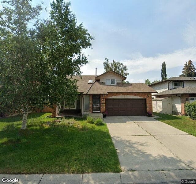 Street view of 75 Woodmont Crescent SW, Calgary