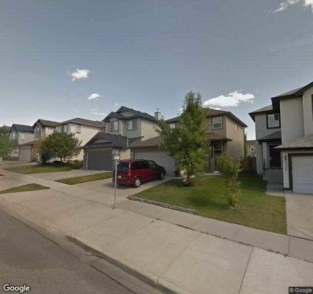 Street view of 124 Tuscany Ravine Road NW, Calgary
