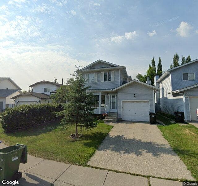 Street view of 56 Woodstock Way SW, Calgary