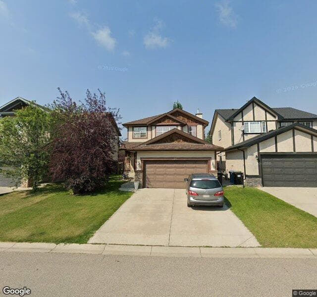 Street view of 54 Cougarstone Mews SW, Calgary