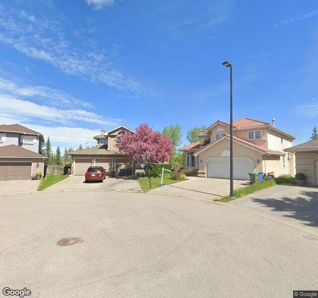 Street view of 618 Mckenzie Lake Bay SE, Calgary