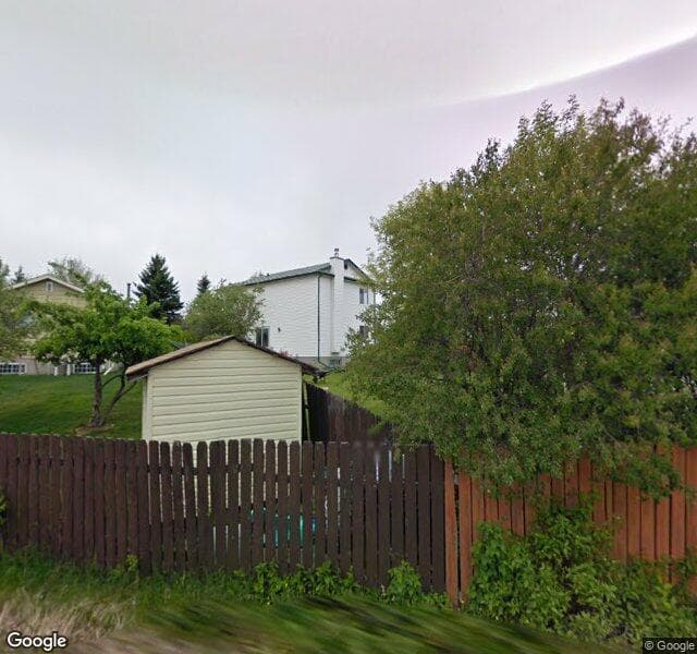 Street view of 64 Riverbrook Place SE, Calgary