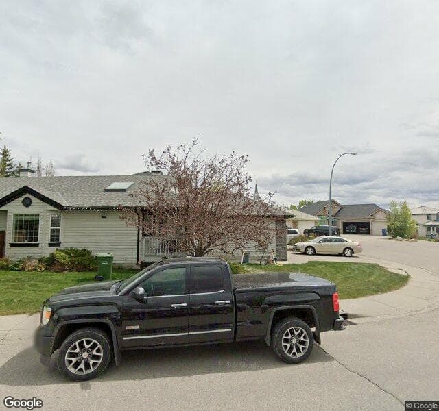Street view of 335 Rocky Ridge Bay NW, Calgary