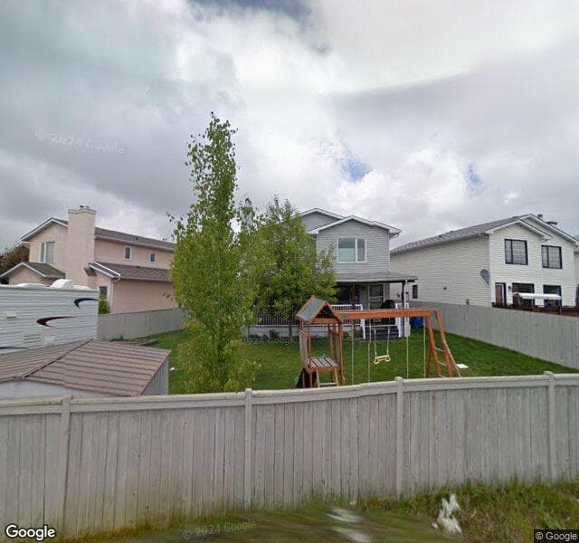 Street view of 47 Riverwood Court SE, Calgary