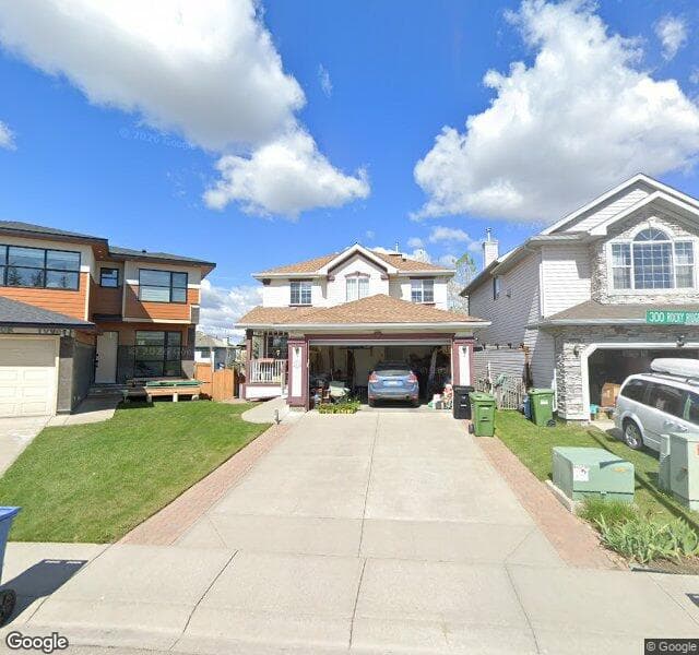 Street view of 331 Rocky Ridge Mews NW, Calgary