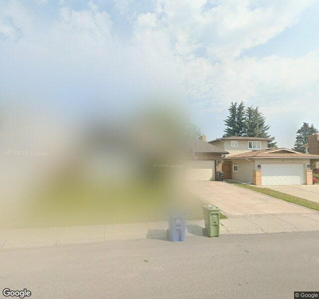 Street view of 8 Woodmont Drive SW, Calgary