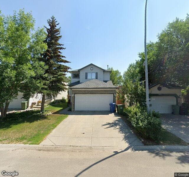 Street view of 406 Mount Apex Green SE, Calgary