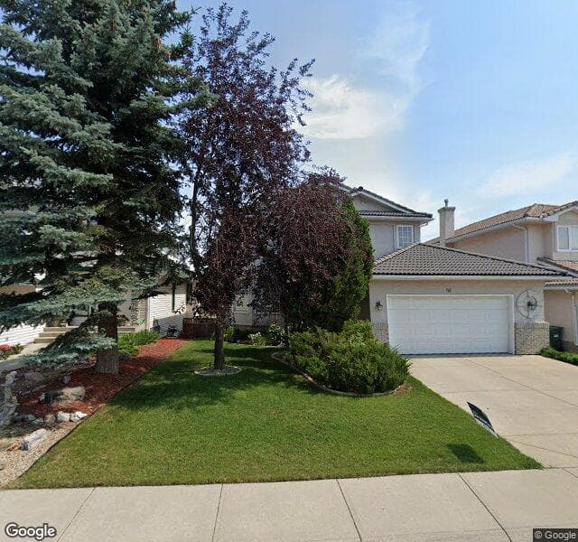 Street view of 96 Woodpark Close SW, Calgary