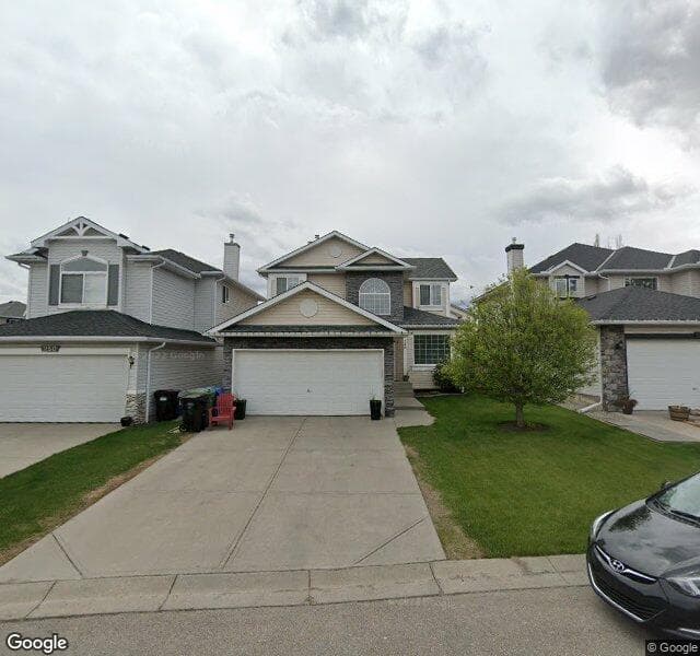 Street view of 246 Rocky Ridge Cove NW, Calgary