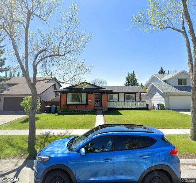 Street view of 716 Woodpark Boulevard SW, Calgary