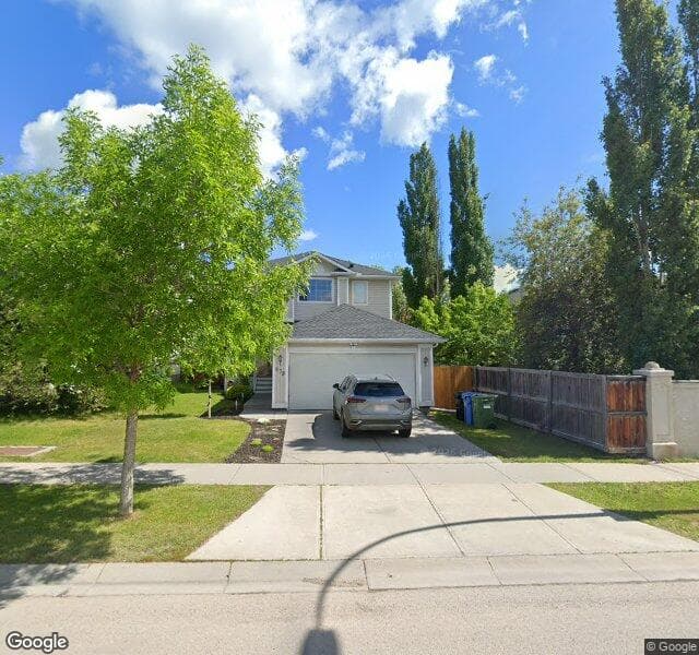 Street view of 879 Tuscany Drive NW, Calgary