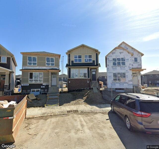 Street view of 58 Creekside Manor SW, Calgary