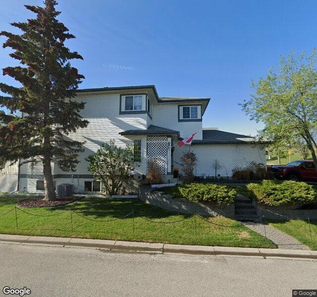 Street view of 203 Hidden Spring Close NW, Calgary