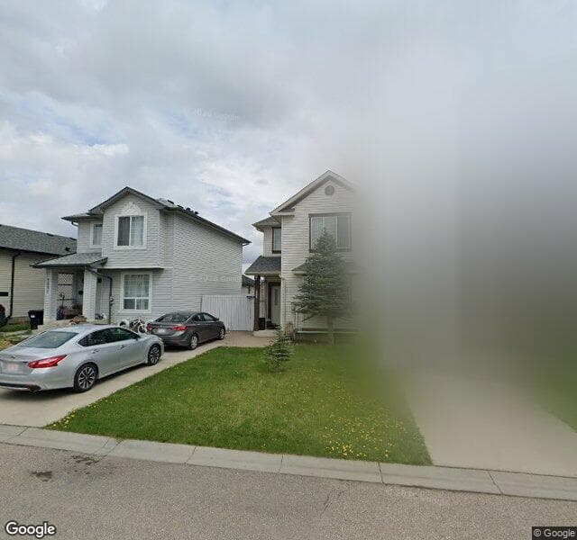 Street view of 1089 Bridlemeadows Manor SW, Calgary