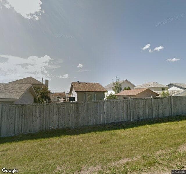 Street view of 18 Rivercrest Way SE, Calgary