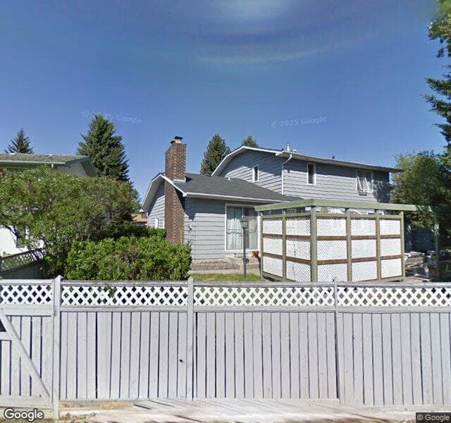 Street view of 244 Lake Moraine Place SE, Calgary