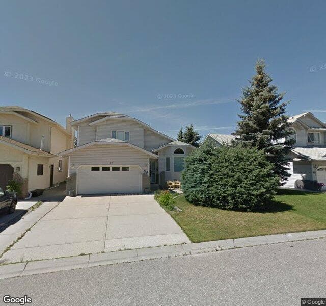 Street view of 89 Woodmark Crescent SW, Calgary