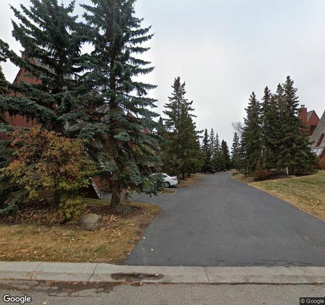 Street view of 1-828 Coach Bluff Crescent SW, Calgary