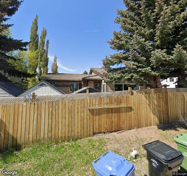 Street view of 836 Coach Side Crescent SW, Calgary