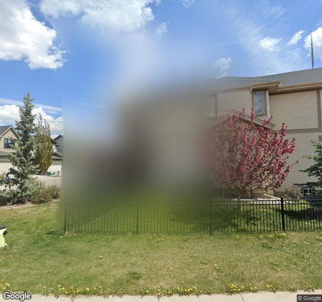 Street view of 128 W Coach Place SW, Calgary