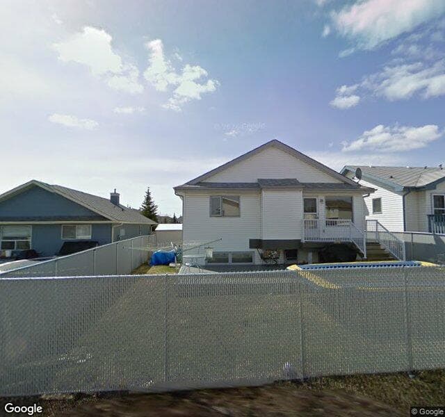 Street view of 895 Harvest Hills Drive NE, Calgary