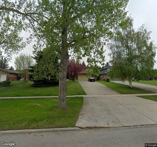 Street view of 1411 Acadia Drive SE, Calgary