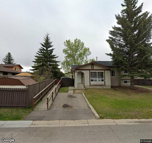 Street view of 11 Deerpoint Road SE, Calgary