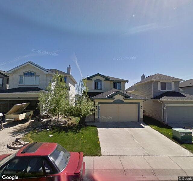 Street view of 1040 Bridlemeadows Manor SW, Calgary