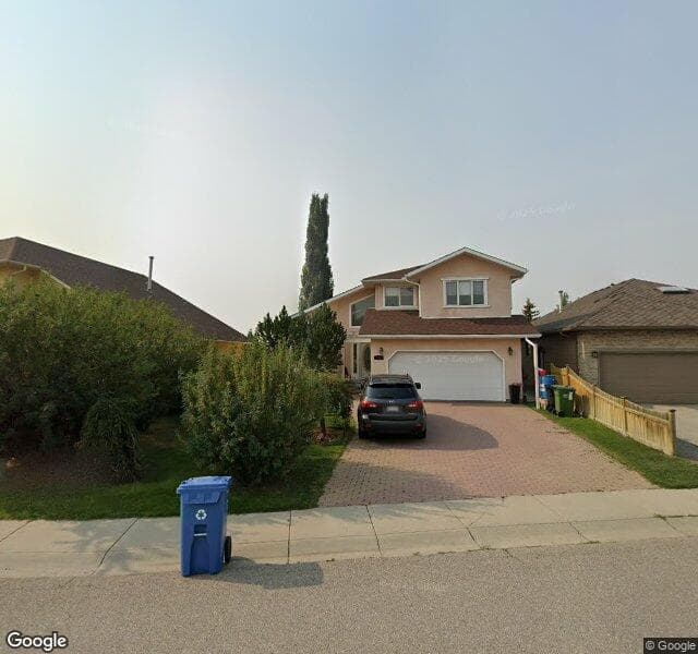 Street view of 235 Scanlon Green NW, Calgary
