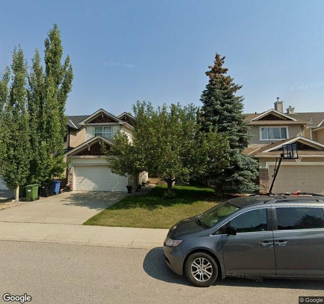 Street view of 24 Cougarstone Villas SW, Calgary