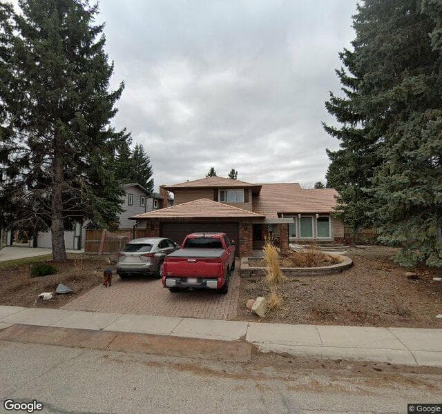 Street view of 615 Lake Moraine Way SE, Calgary