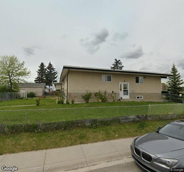 Street view of 6051 8 Avenue SE, Calgary
