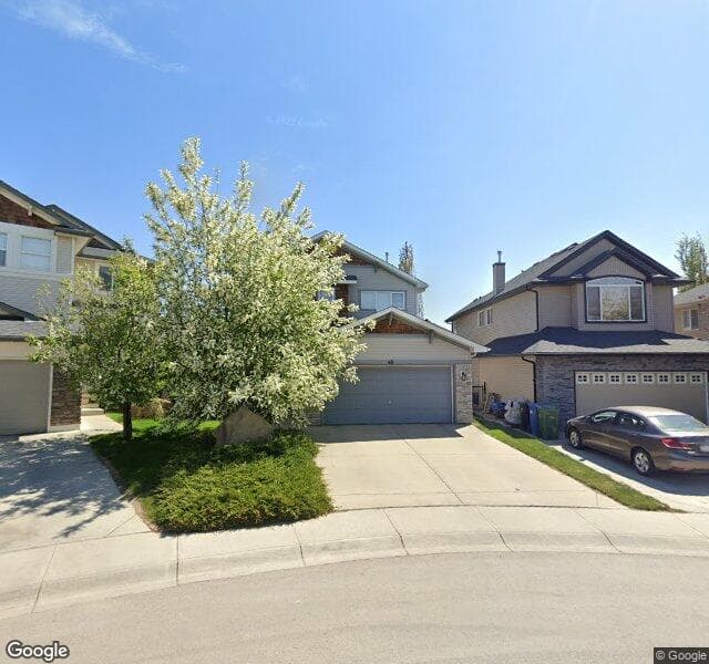Street view of 48 Cougarstone Manor SW, Calgary